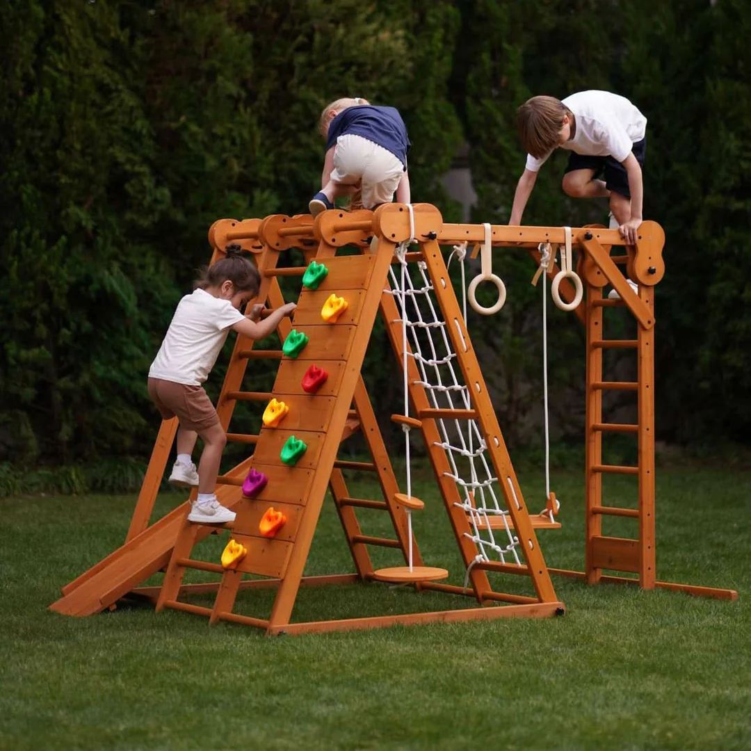 Children playing on jungle gym at Mini Explorers school